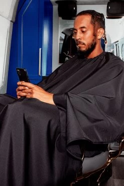 BARBER STRONG - The Hands-Free Barber Cape - Solid Black 12 BARBER STRONG - The Hands-Free Barber Cape - Solid Black -Care Product Shop BSC12 BLKHF The Barber Cape Hands Free MODEL 3 1800x1800.png 24780.1629688092