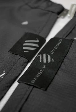 BARBER STRONG - The Barber Cape - Black W/White Pinstripe 16 BARBER STRONG - The Barber Cape - Black W/White Pinstripe -Care Product Shop The Barber Shield Details Black Details3 1024x1024 29315.1564732476